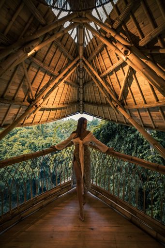 A vertical shot of a young girl in the home in Bali, Indonesia