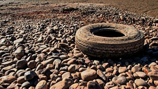 A selective focus shot of an old car tire on the ground