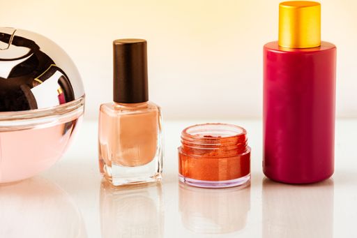 A closeup of different beauty products on the table against a blurry background