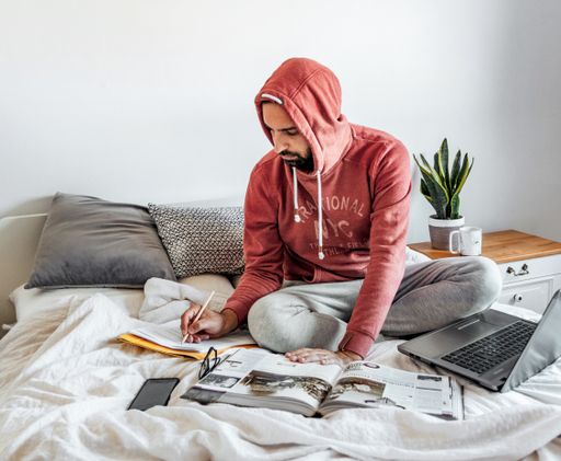 A closeup shot of a man working from home during the Coronavirus pandemic