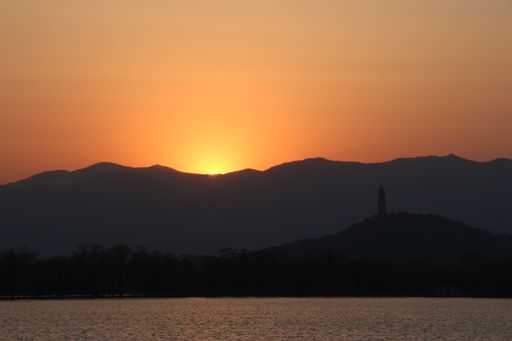 A beautiful view of a dramatic sunset over the nature and lake