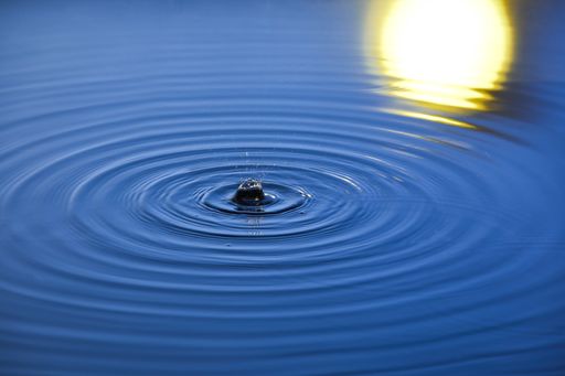 A high angle shot of ripples on the surface of the water