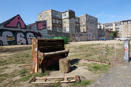 An old weathered piano in the back streets of Norrebro, Copenhagen, Denmark