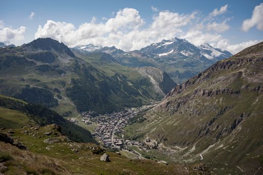A scenic view of a beautiful landscape with valleys and mountains seen on a bright sunny day