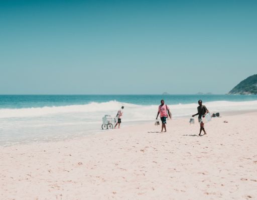 Beautiful landscape shot of Ipanema beach with vendors during a blue sky day.