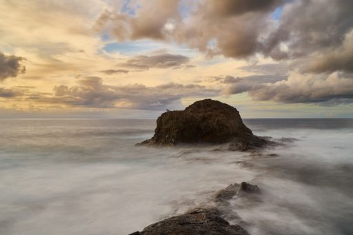 A beautiful shot of a sunset by the seashore in Grand Canary Island, Spain