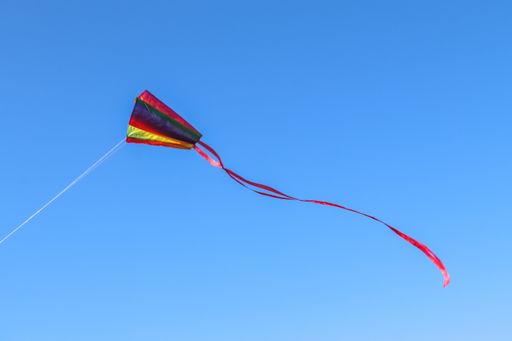 A colorful kite flying in the air