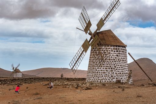 La Oliva, Fuerteventura, Spain : 2020 October 4 : Family taking a photo at the Windmills in La Oliva on the island of Fuerteventura in Spain in 2020