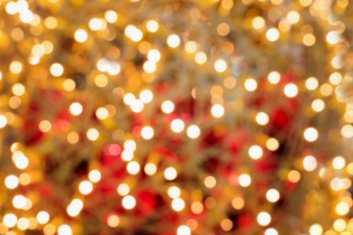 A glittering background of yellow and red bokeh effect lights - a nice picture for wallpapers