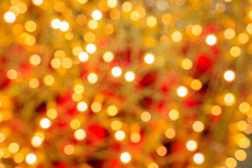 A glittering background of yellow and red bokeh effect lights - a nice picture for wallpapers