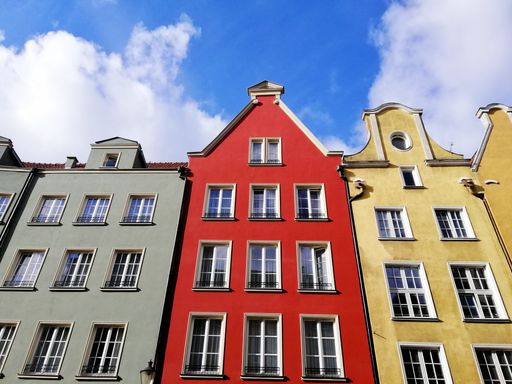 A low angle shot of colorful tenament houses facades in old city of Gdansk, Poland