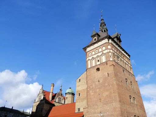 A low angle shot of a traditional historic building in the old town of Gdansk, Poland under a clear sky