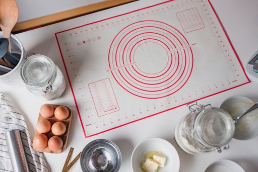 A top view shot of baking ingredients on a white table