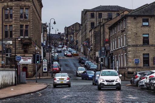 A street view of Halifax with cars on a rainy day in the United Kingdom