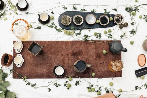 A top view of the cups of different types of coffee on the white table