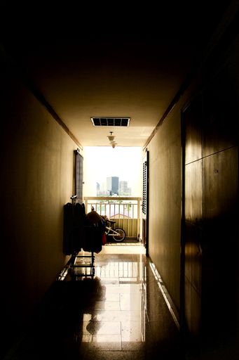 A vertical shot of a living complex with a balcony