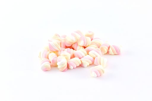 A top view closeup of colorful marshmallows isolated on a white background