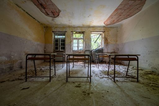 A dilapidated classroom in an abandoned children's home