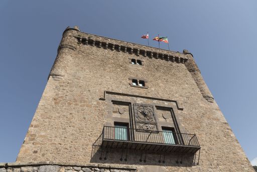 A low angle shot of a stone-made historical medieval tower in Potes, Cantabria, Spain under a clear sky
