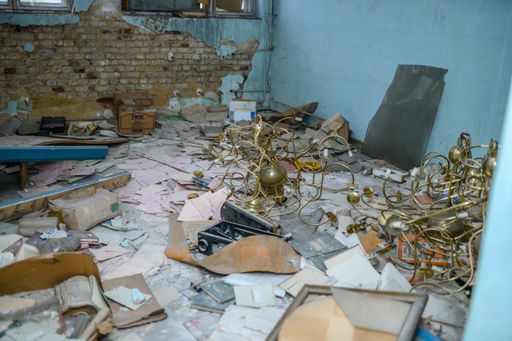 A scattered abandoned dirty room of an old damaged building