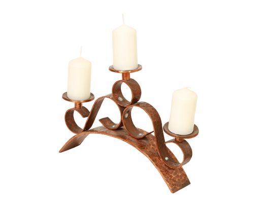 An antique candle stand on a white background