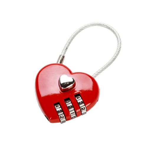 A heart-shaped combination padlock isolated on white background