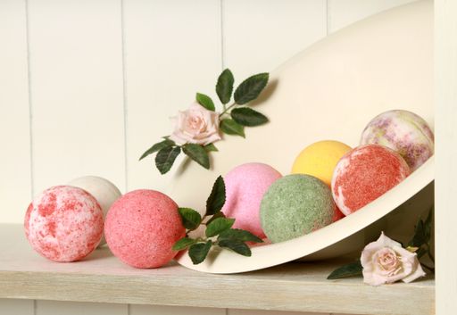 A closeup shot of colorful bath bombs on the shelf