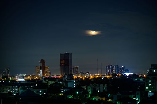 An aerial view of modern buildings during the dark night