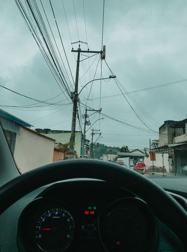 The power transmission lines in Rio de Janeiro during a cloudy day photographed from a car
