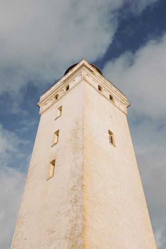 A vertical shot of the lighthouse Rubjerg Knude in Denmark