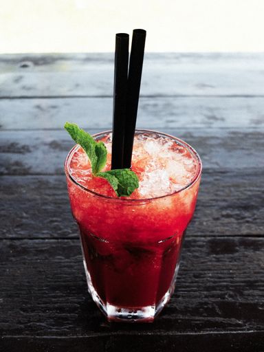 A vertical closeup high angle shot of a strawberry mojito