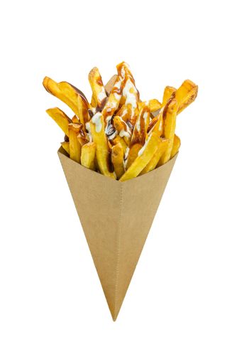 A vertical closeup shot of french fries with sauces in a cardboard cone isolated on a white background