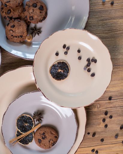A top view of the white dish set with chocolate chip cookies and seasonings