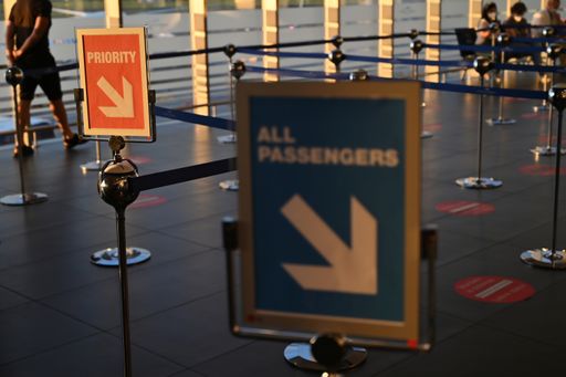 A selective focus shot of priority lane and information sign