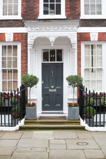 The vertical shot of the exquisite brick house in London, England
