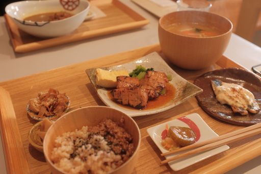 A high angle shot of a wooden tray of delicious dishes