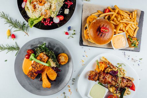 A top view of a restaurant table with delicious gourmet foods