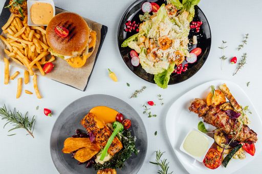 A top view of a restaurant table with delicious gourmet foods