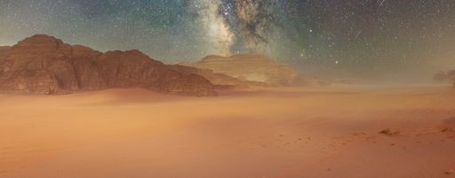 Desert and rocks on extraterrestrial or alien planet in the universe with view on space and galaxy. Sci-fi simulation.