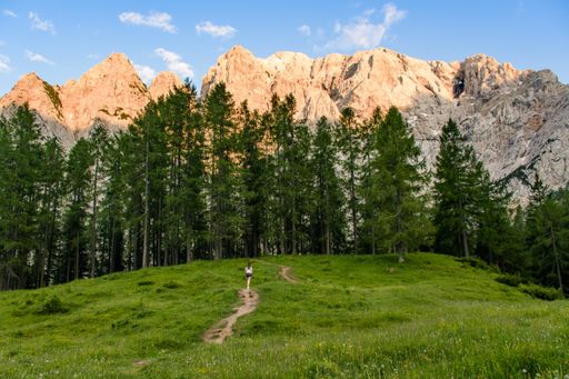 A beautiful mountainous landscape with greenery under a cloudy sky