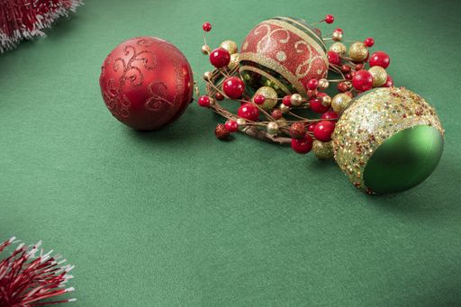 A shot of several Christmas decorations on a green surface