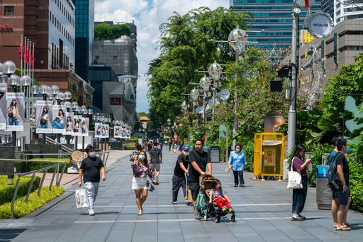 The people walking along Orchard road in Singapore