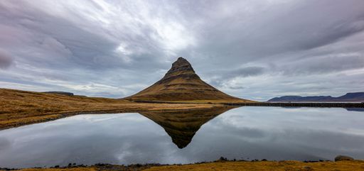 The Kirkjufell mountain in a cloudy weather - panoramic shot