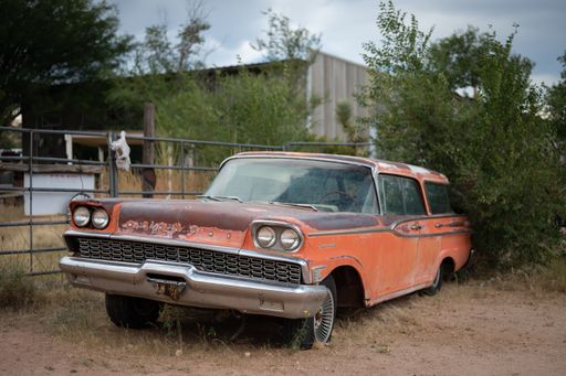 An old Mercury Commuter abandoned in a remote town in the United States
