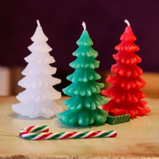 A closeup shot of colorful Christmas tree shaped candles