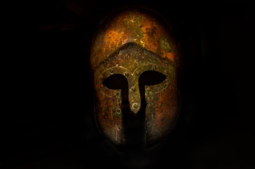 An ancient Viking warrior's helmet from the Bronze Age isolated on a black background