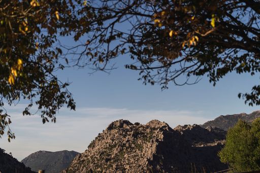 A beautiful shot of rocky mountains under a blue sky in the countryside