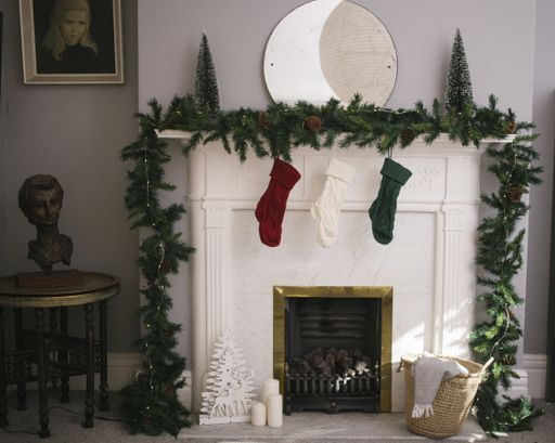 the  socks hung from a green chain under the mirror