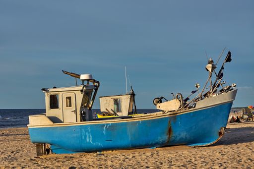 Traditional fishing boat on Baltic Sea beach in Katy Rybackie village.