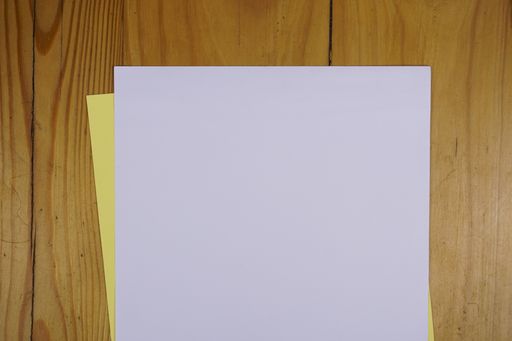 Colorful sheets of paper on a wooden table